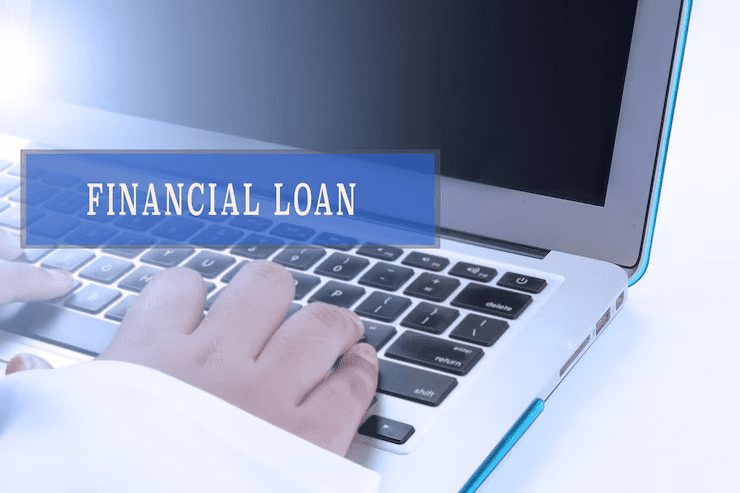 "Close-up of a person typing on a laptop keyboard with the words 'Financial Loan' overlaid on the screen, symbolizing online loan application or digital financial services."