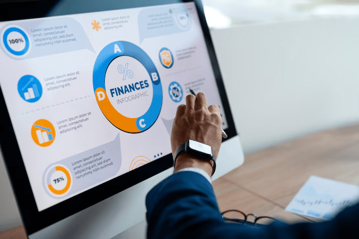 A person in business attire interacting with a touchscreen monitor displaying a colorful financial infographic labeled “Finances,” including graphs, percentages, and data points—symbolizing data analysis, financial planning, or business strategy.